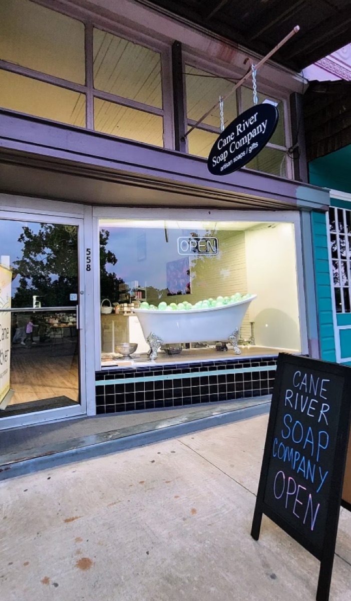Cane River Soap Company storefront at 558 Front Street, Natchitoches, with the OPEN sign lit in the window